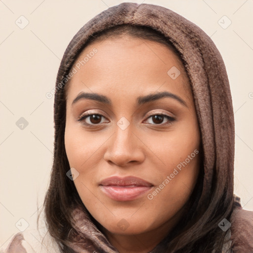 Joyful latino young-adult female with long  brown hair and brown eyes