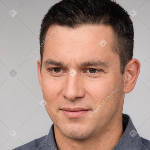 Joyful white adult male with short  brown hair and brown eyes