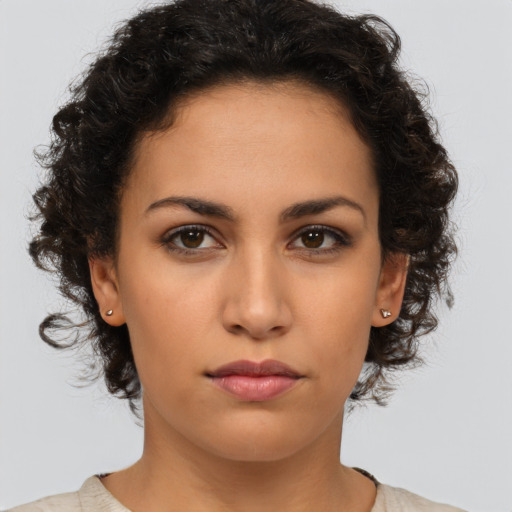 Neutral latino young-adult female with medium  brown hair and brown eyes