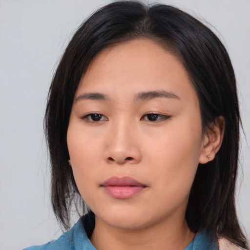 Neutral asian young-adult female with medium  brown hair and brown eyes