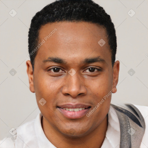 Joyful black young-adult male with short  black hair and brown eyes