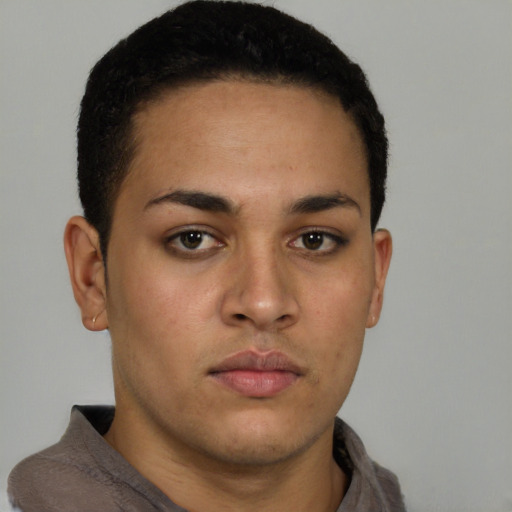 Neutral latino young-adult male with short  brown hair and brown eyes