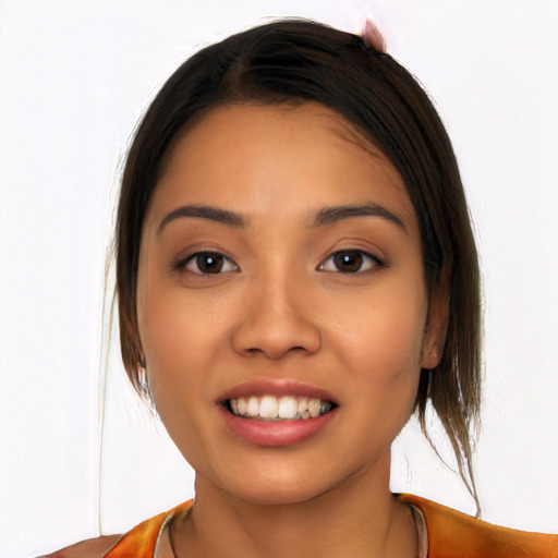 Joyful latino young-adult female with long  brown hair and brown eyes