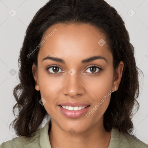 Joyful black young-adult female with long  brown hair and brown eyes