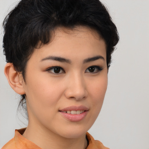Joyful asian young-adult female with short  brown hair and brown eyes