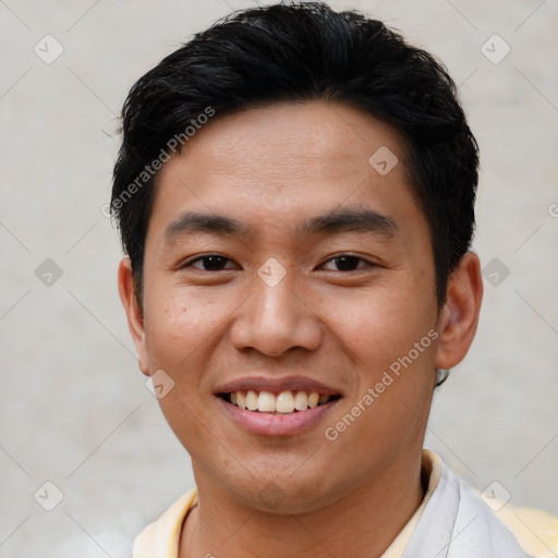 Joyful asian young-adult male with short  brown hair and brown eyes