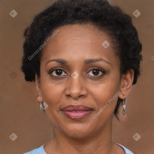 Joyful black adult female with short  brown hair and brown eyes