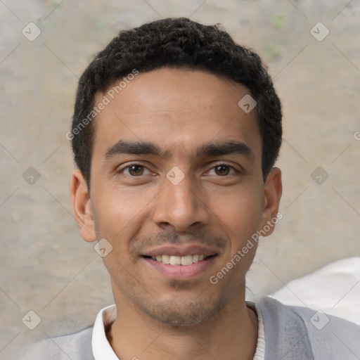 Joyful latino young-adult male with short  black hair and brown eyes