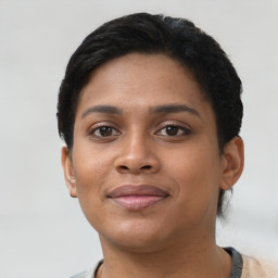 Joyful latino young-adult female with short  brown hair and brown eyes