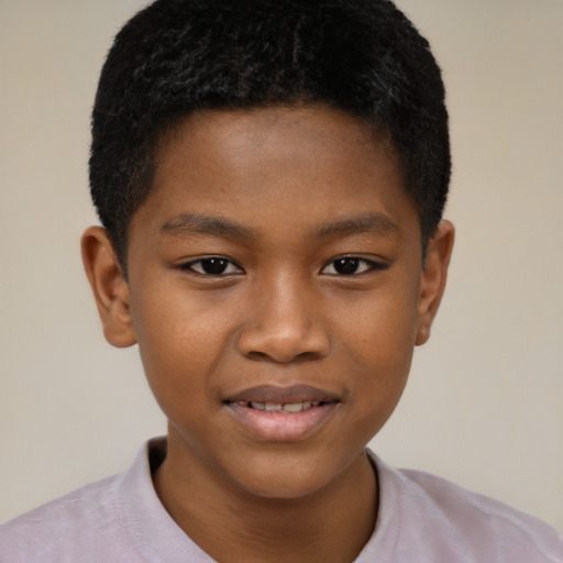 Joyful black child male with short  brown hair and brown eyes