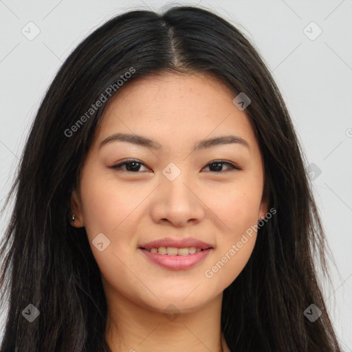 Joyful asian young-adult female with long  brown hair and brown eyes