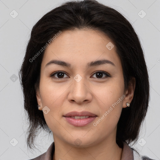 Joyful latino young-adult female with medium  brown hair and brown eyes