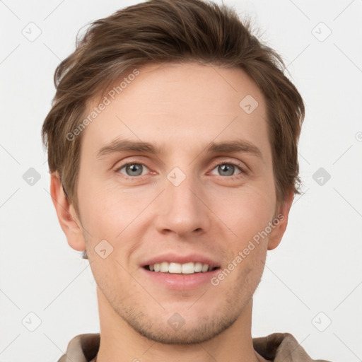 Joyful white young-adult male with short  brown hair and grey eyes