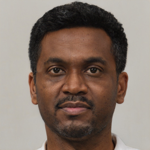 Neutral black adult male with short  black hair and brown eyes