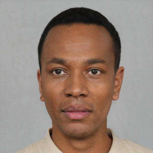 Neutral black young-adult male with short  black hair and brown eyes