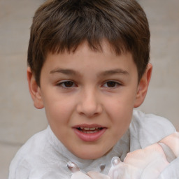 Joyful white child male with short  brown hair and brown eyes