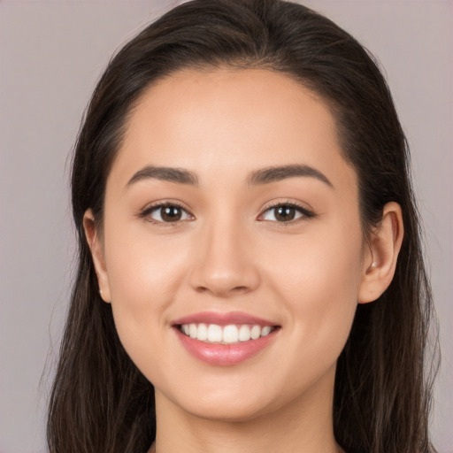 Joyful white young-adult female with long  brown hair and brown eyes