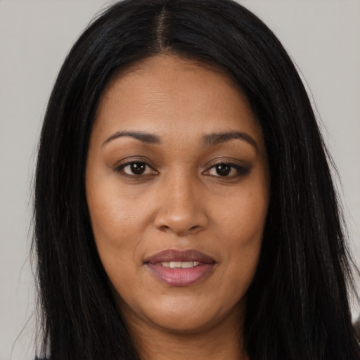Joyful asian young-adult female with long  black hair and brown eyes