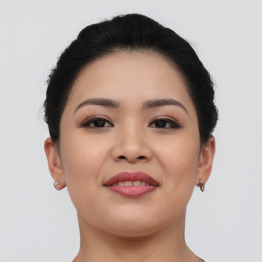 Joyful asian young-adult female with short  brown hair and brown eyes