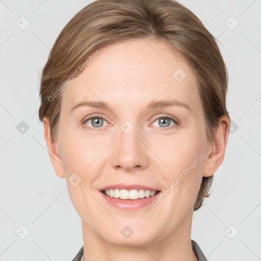 Joyful white young-adult female with short  brown hair and grey eyes