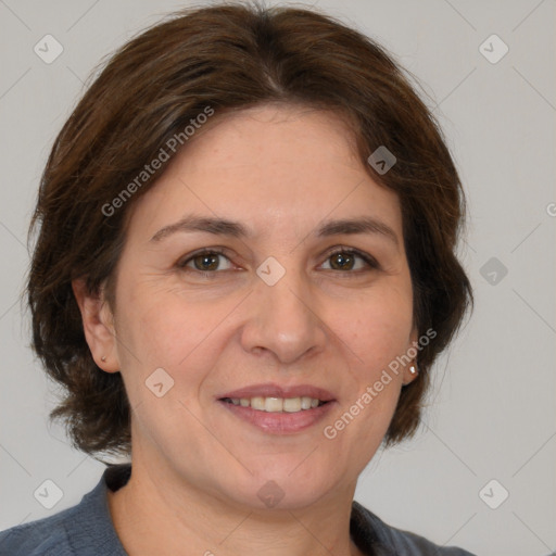 Joyful white adult female with medium  brown hair and grey eyes