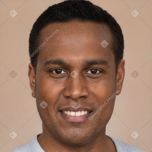 Joyful black young-adult male with short  black hair and brown eyes