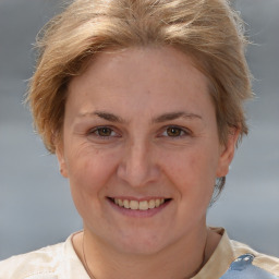 Joyful white adult female with short  brown hair and brown eyes