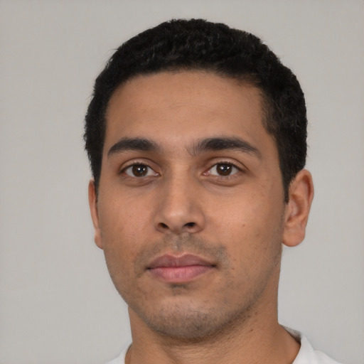 Neutral latino young-adult male with short  black hair and brown eyes