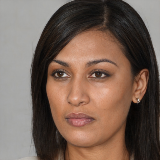 Neutral asian young-adult female with long  brown hair and brown eyes
