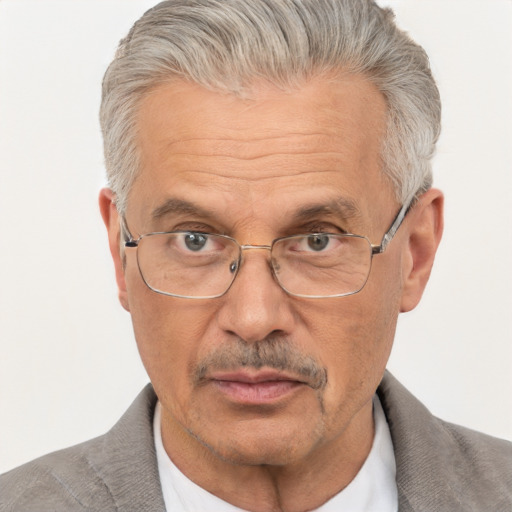 Neutral white middle-aged male with short  gray hair and brown eyes