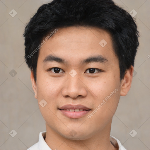 Joyful asian young-adult male with short  black hair and brown eyes