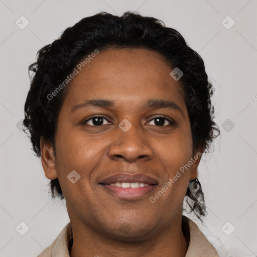 Joyful black young-adult female with short  brown hair and brown eyes