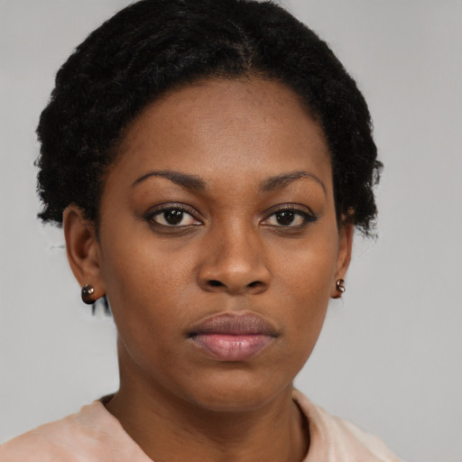 Neutral black young-adult female with short  black hair and brown eyes