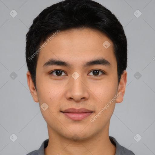 Joyful asian young-adult male with short  black hair and brown eyes