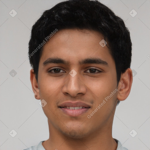 Joyful latino young-adult male with short  black hair and brown eyes