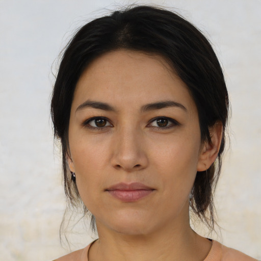 Joyful asian young-adult female with medium  brown hair and brown eyes