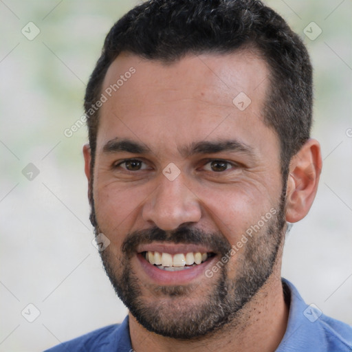 Joyful white young-adult male with short  black hair and brown eyes