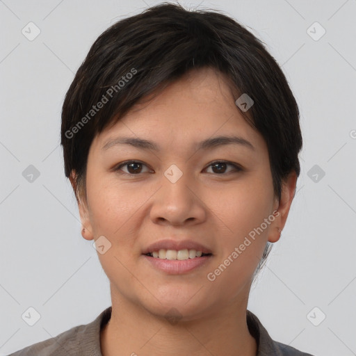 Joyful asian young-adult female with short  brown hair and brown eyes