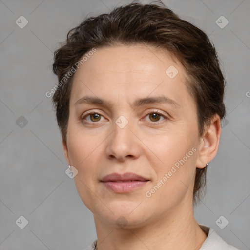 Joyful white adult female with short  brown hair and brown eyes