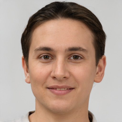 Joyful white young-adult male with short  brown hair and brown eyes