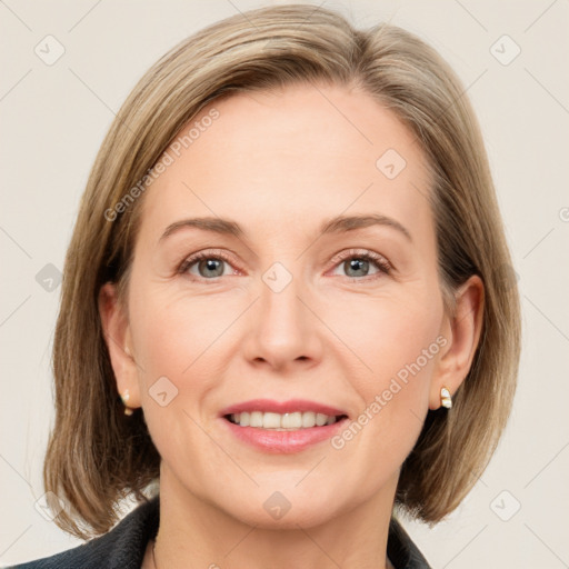 Joyful white adult female with medium  brown hair and grey eyes