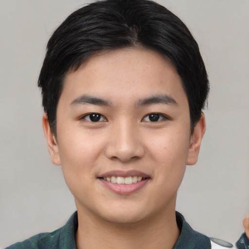 Joyful asian young-adult male with short  black hair and brown eyes