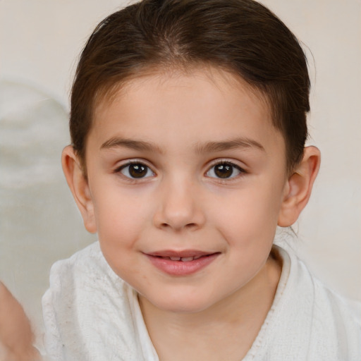 Joyful white child female with short  brown hair and brown eyes