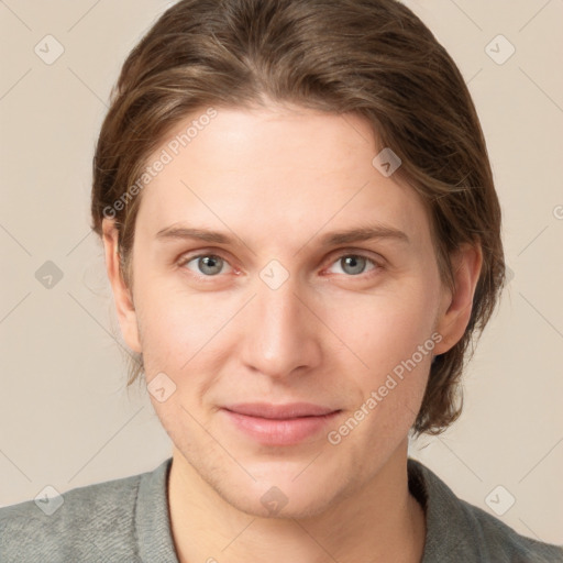 Joyful white young-adult female with short  brown hair and grey eyes