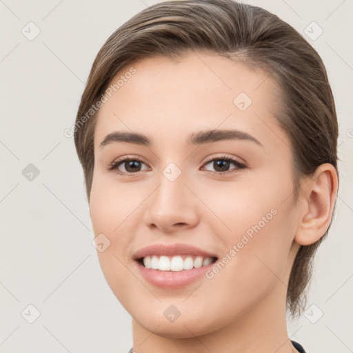 Joyful white young-adult female with medium  brown hair and brown eyes