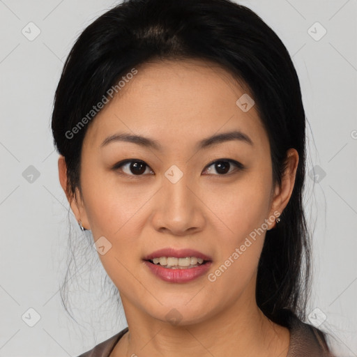 Joyful asian young-adult female with short  black hair and brown eyes