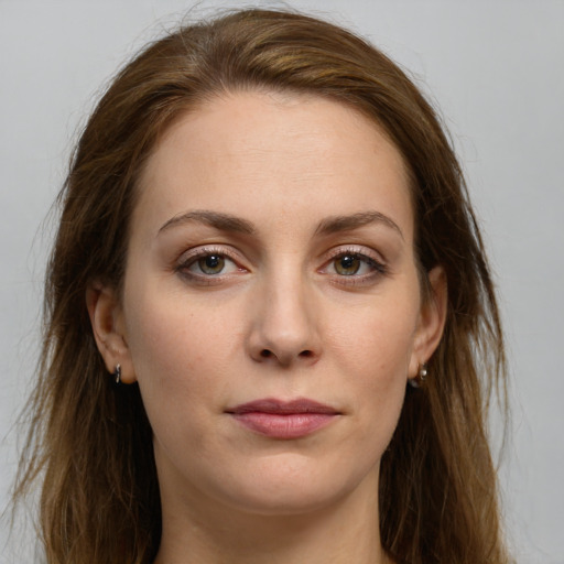 Joyful white young-adult female with long  brown hair and grey eyes