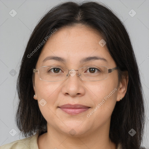 Joyful white adult female with long  brown hair and brown eyes