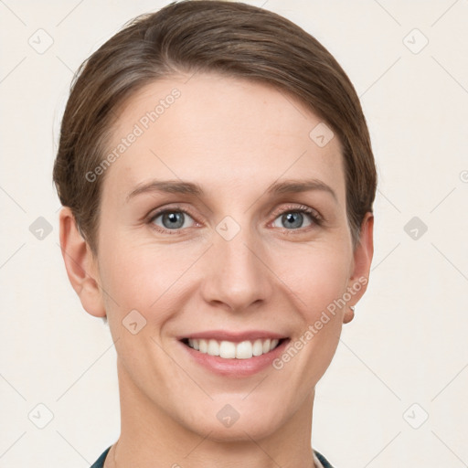 Joyful white young-adult female with short  brown hair and grey eyes