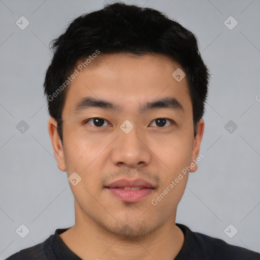 Joyful asian young-adult male with short  black hair and brown eyes